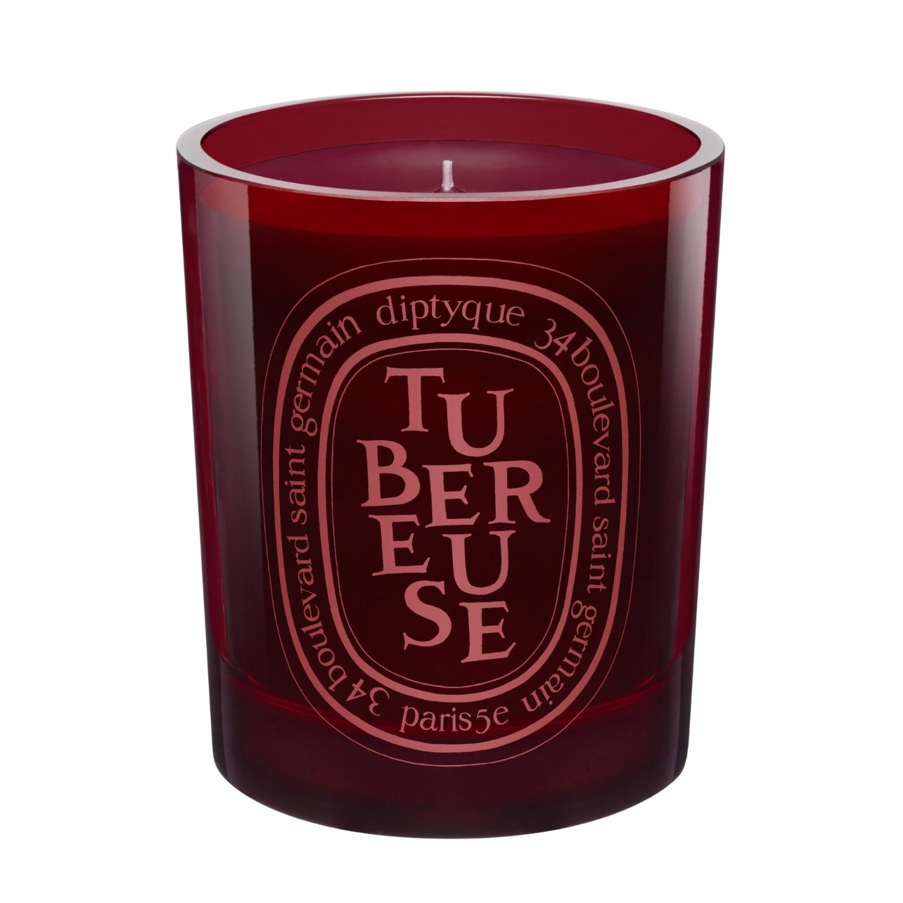 Diptyque dark red glass candle jar labeled tubereuse